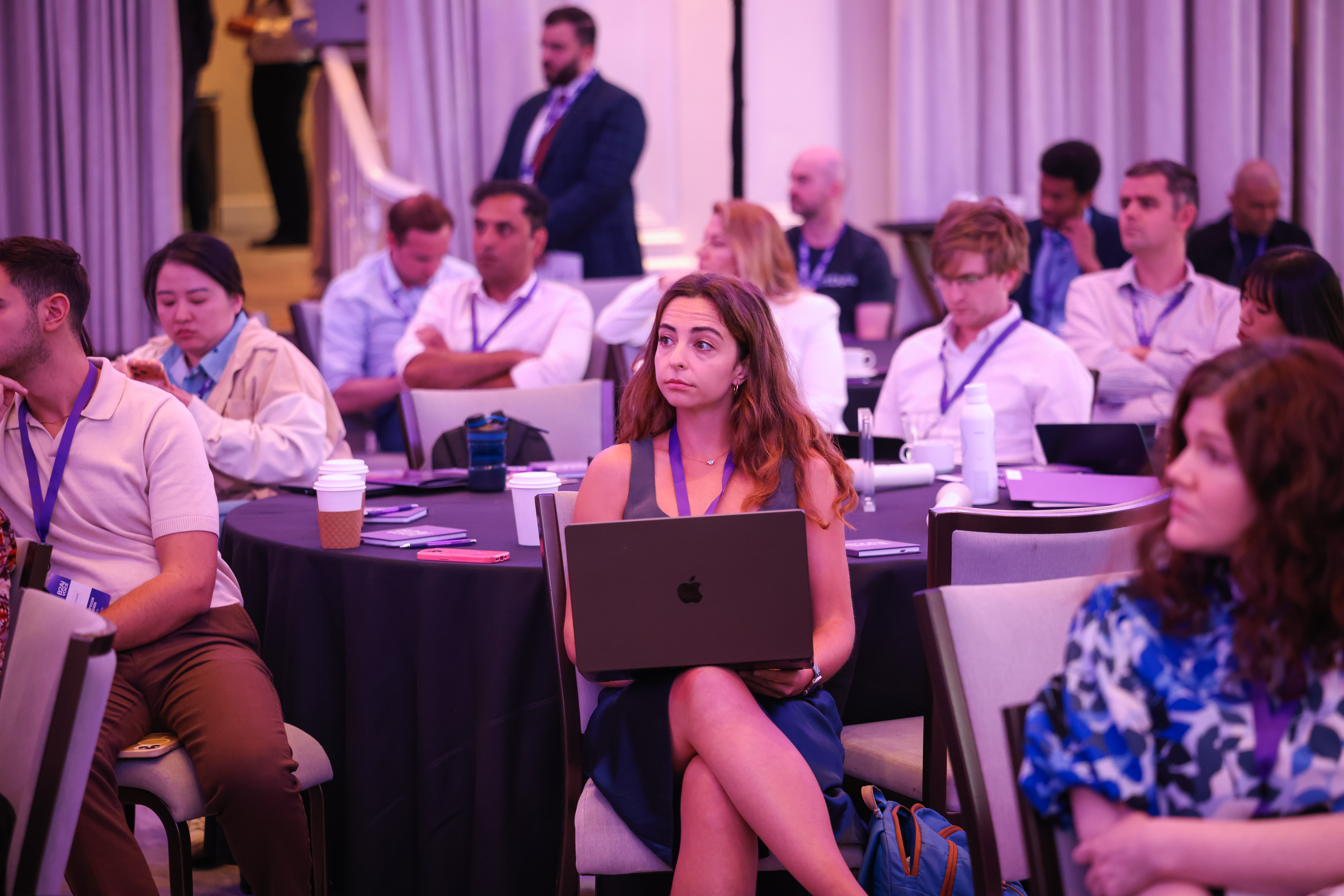 Voice AI Symposium attendees participating in a conference session